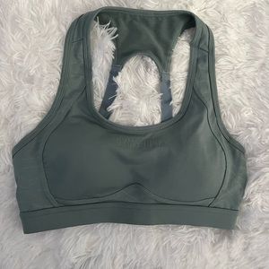 Gymshark sports bra in jade green worn 1x. Cut tag off size Medium.